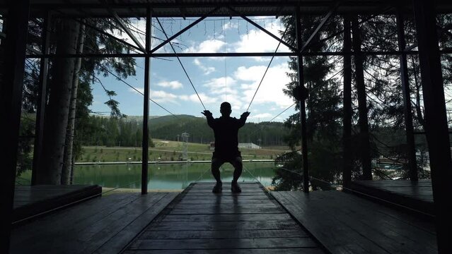 Time lapse of man making exercises on a viewing mountains spot