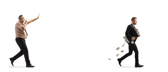 Full length profile shot of a security guard chasing a businessman with a suitcase full of money