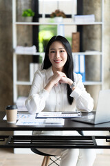 Fototapeta premium Asian woman working with laptop in her office. business financial concept.