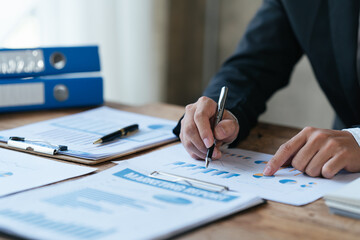 Businessman analysis marketing plan, Accountant calculate financial report, Accounting Calculating Cost Economic Financial data.