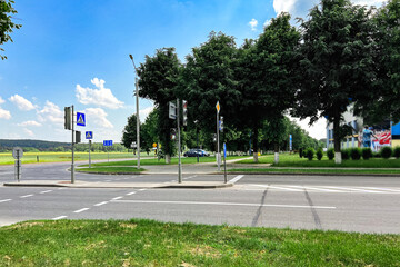 Urban pedestrian crossing with traffic lights.