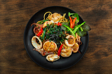 Spaghetti with Squids Stir Fried Spicy Basil Sauce