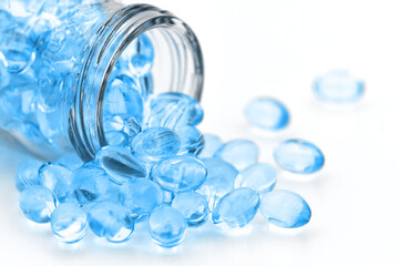 Oil soft gelatin capsules on white background.