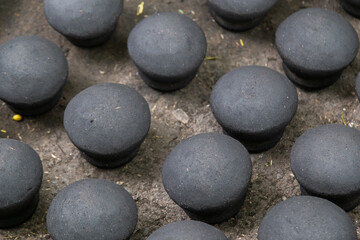Fototapeta na wymiar Black clay earthen pots kept to dry