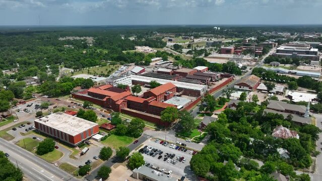 Texas State Penitentiary at Huntsville. Walls Unit in TX prison system. Aerial orbit. Electrocution and execution common at this site in USA.