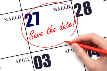 Hand drawing red line and writing the text Save the date on calendar date March 27.