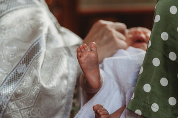 Obraz na płótnie Canvas Newborn baby during christening
