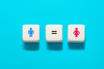 Male and female symbols on wooden cube. concept of gender equality