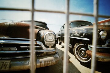 Front of an old classic car. Headlight close-up.