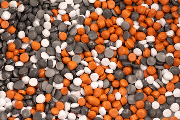 Light gray, dark gray, white and brown PVC raw materials background. PVC fitting