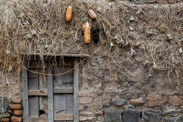 Traditional broken wooden door for mud house. Old and vintage local style of architecture in Maharashtra, India
