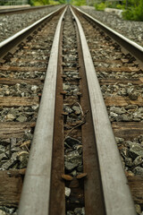 Bolts on a train track used by commuter and freight trains in a suburban town. 