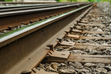 A train track used by commuter and freight trains in a suburban town.