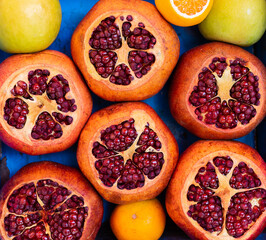 Fruits prepared to make juice, pomegranate, orange, apple, lemon