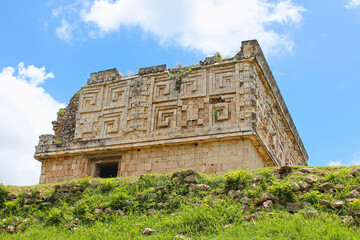 Fototapeta premium Governor palace, territory of the Uxmal historical site, ancient city, representative of the Puuc architectural style, Yucatan peninsula, Mexico. Soft focus