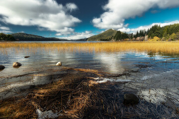 Landscape with mountains, lake and snow