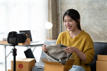 Starting small businesses SME owners female entrepreneurs check online orders to prepare to pack...