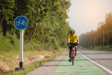 Asian men are cycling road bike in the morning