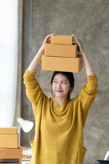 Starting small businesses SME owners female entrepreneurs check online orders to prepare to pack the boxes, sell to customers, sme business ideas online.