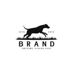 silhouette dog running on grass logo design, creative dog training logo illustration, animal dog vector template