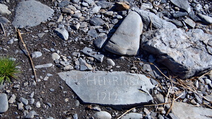 Carved rock on the beach, dating from 1912, at Jason Harbor on South Georgia Island