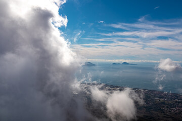 Panoramic view from volcano Mount Vesuvius on the bay of Naples, Province of Naples, Campania region, Italy, Europe, EU. Looking at the island of Capri and Mediterranean coastline on a cloudy day.