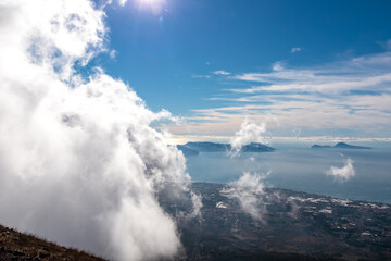 Panoramic view from volcano Mount Vesuvius on the bay of Naples, Province of Naples, Campania region, Italy, Europe, EU. Looking at the island of Capri and Mediterranean coastline on a cloudy day.