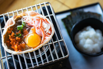 Japanese food, Krab boiled grill Kani Miso grill on the stove. © kannapon
