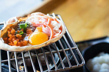 Japanese food, Krab boiled grill Kani Miso grill on the stove. © kannapon