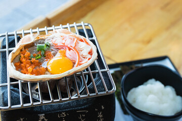 Japanese food, Krab boiled grill Kani Miso grill on the stove. © kannapon