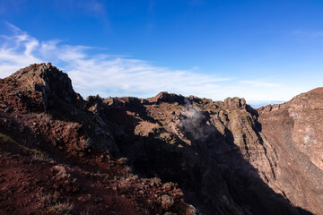 Panoramic view on the edge of the active volcano crater of Mount Vesuvius, Province of Naples, Campania region, Southern Italy, Europe, EU. Volcanic landscape full of stones, ashes and solidified lava