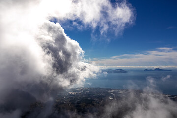 Fototapeta na wymiar Panoramic view from volcano Mount Vesuvius on the bay of Naples, Province of Naples, Campania region, Italy, Europe, EU. Looking at the island of Capri and Mediterranean coastline on a cloudy day.
