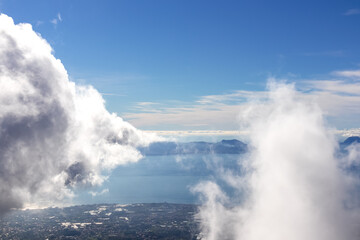 Panoramic view from volcano Mount Vesuvius on the bay of Naples, Province of Naples, Campania region, Italy, Europe, EU. Looking at the island of Capri and Mediterranean coastline on a cloudy day.