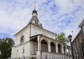 Fototapeta na wymiar Belfry of the Church of St. Nicholas the Good in Pokrovskaya Street in Kyiv, Ukraine