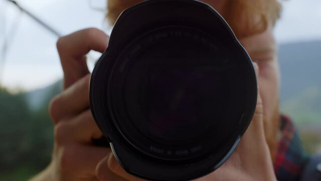 Closeup camera objective take picture of nature. Photographer make shoot photo.