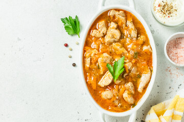 Classic comfort food goulash in pot. Top view, copy space.