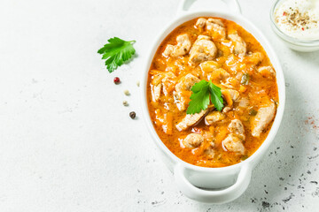 Gravy spicy beef goulash in pot. Top view, copy space.