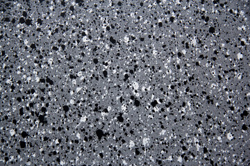 Texture of gray spotted stone. Gray speckled background