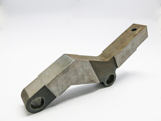 Rusty gray iron metal, perforated, 1 piece brown-black stain placed on a white background.