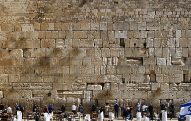 Notes in the Wailing Wall in Jerusalem with their requests and desires addressed to God. - obrazy, fototapety, plakaty
