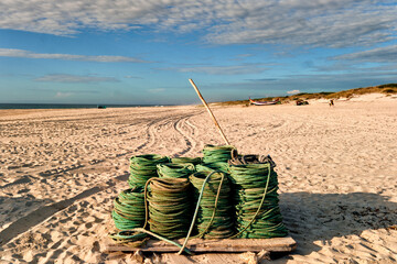 colorful fishing nets on the sand, along the Atlantic, on the beach of Torreira, Portugal