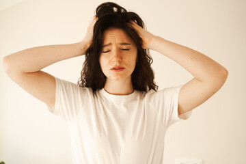 Sad woman with migraine strong headache disease. Depression. Overstressed woman with head pain...
