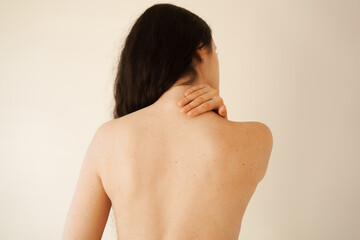 Cervical spine osteochondrosis is radicular syndromes of young woman. Attractive girl feel spine...