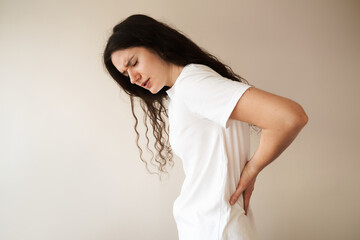 Kidney infection pyelonephritis urinary tract infection. Attractive woman feel backache spine pain because of UTI pyelonephritis disease. - obrazy, fototapety, plakaty
