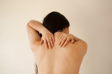 Cervical spine osteochondrosis is radicular syndromes of young woman. Attractive girl feel spine pain because of spinal nerves compression.