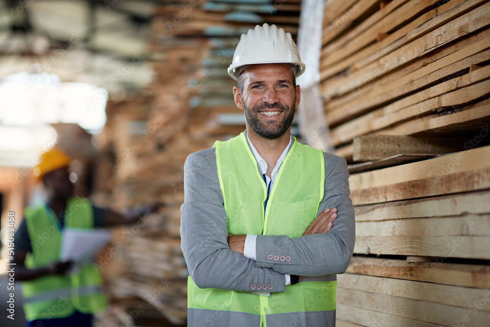 Wall mural Portrait of confident wood warehouse owner looking at camera.