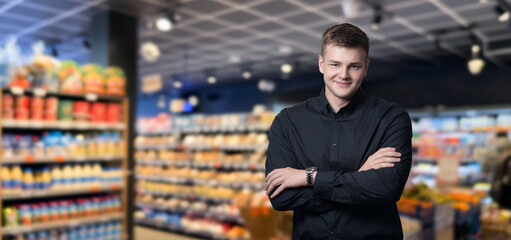 Fototapeta premium A businessman in a standing with his arms crossed .
