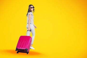 Happy young woman running and holding baggage