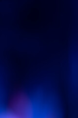 Neon light flare. Blur glow overlay. Futuristic glare. Defocused fluorescent navy blue pink purple color flecks reflection on dark presentation copy space abstract background.