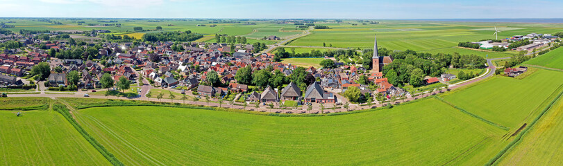 Fototapeta na wymiar Aerial panorama from the historical village Holwerd near de Wadden Sea in Friesland the Netherlands